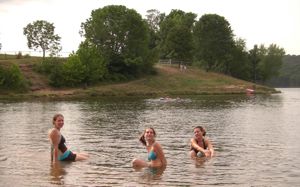 three girls in a lake