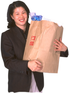 woman holding a bag of groceries